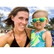 Kayla Pearson holds three year old daughter with sunglasses