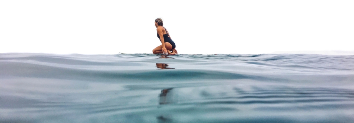 women surfer in the water